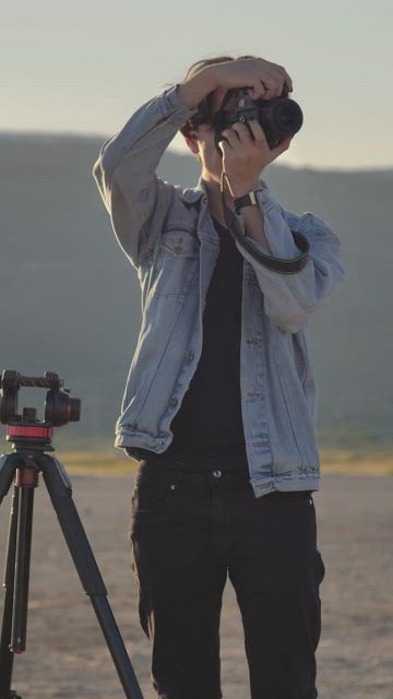 Photographer working outside in a desert.