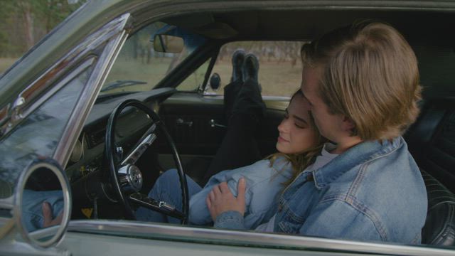 Boy and girl during a stop on a road trip.