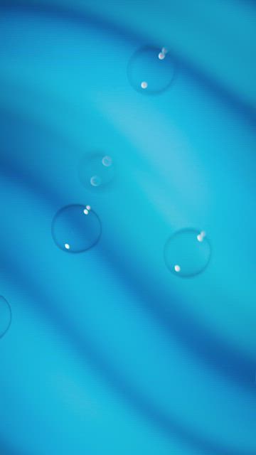 Many bubbles rising on a blue background in waves.