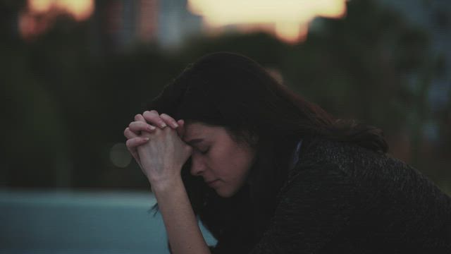 Worried and sad woman, outdoors.