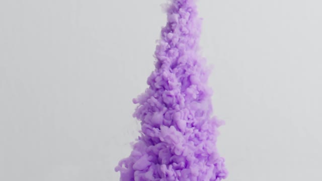 Violete smoke or paint flows form top to bottom over a white liquid background.