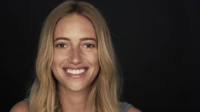 Young woman smiling and laughing.