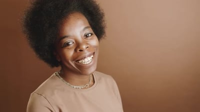 Joyous Black Woman Smiling and Laughing at Camera.