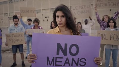 Woman in Demonstration Looking at the Camera with Serious Face.