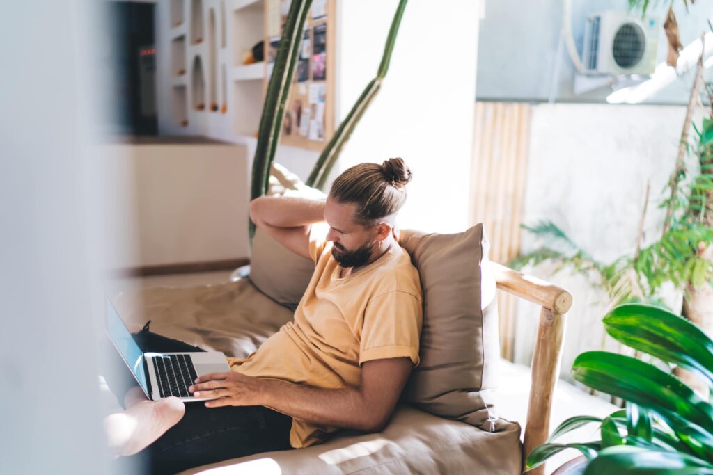 freelancer looking at laptop with concern