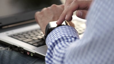 Businessman Watching Time On a Smart Watch.