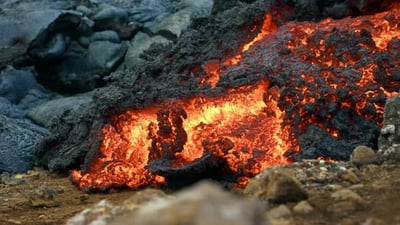 Lava Flow At Fagradalsfjall, Iceland - Molten Red and Orange Lava Flow - close up.