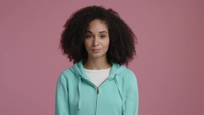 Close Up Shot of Single Beautiful Young Woman with Positive Facial Expression.