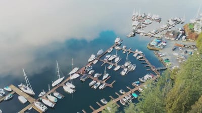 Stunning Aerial View of Deep Cove Marina in North Vancouver in BC Canada on a foggy day with beautif.