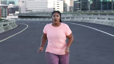 Fitness, city and black woman running on road for weightloss, body wellness and healthy lifestyle.